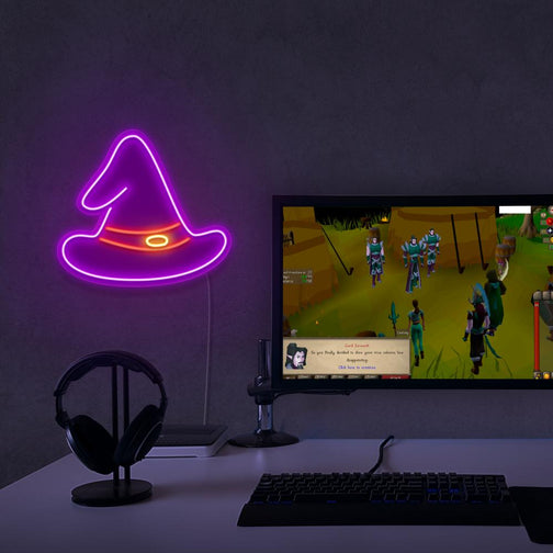 The OSRS Wizard Hat LED neon sign proudly sits next to a gaming PC, symbolizing the magic and mystique of wizards in Old School RuneScape. An emblem of arcane knowledge and power, this LED neon sign adds a touch of enchantment and wonder to any gaming space.