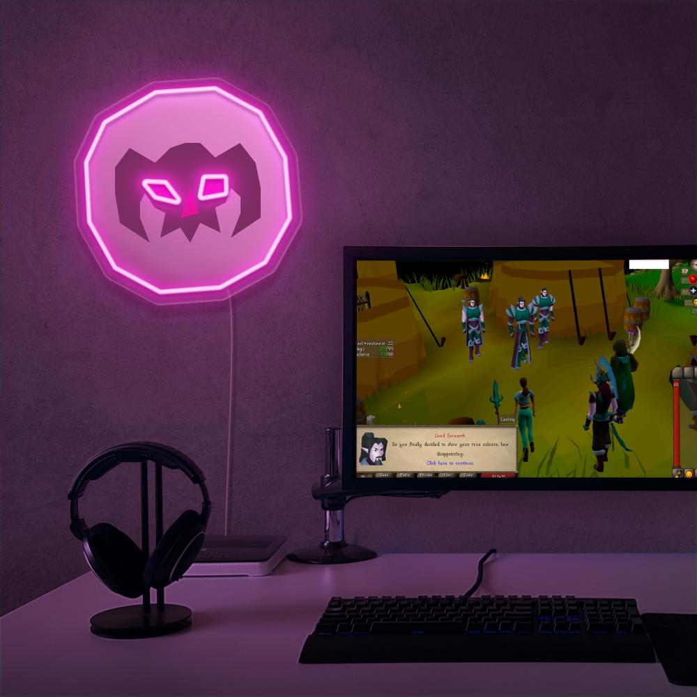 The OSRS Wrath Rune LED neon sign proudly sits next to a gaming PC, symbolizing the destructive power of magic in Old School RuneScape. An emblem of magic and destruction, this LED neon sign adds a touch of mystique and power to any gaming space.
