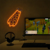 The Runescape Infernal Cape LED neon sign proudly sits next to a gaming PC, symbolizing the dedication and skill required to achieve the Infernal Cape in Old School RuneScape. A unique gift for RS enthusiasts seeking a challenge.