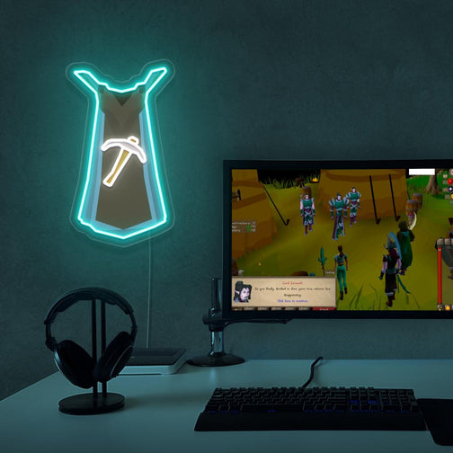 The Runescape Mining Skillcape LED neon sign proudly sits next to a gaming PC, symbolizing the dedication and skill required to achieve mastery in mining in Old School RuneScape. An emblem of hard work and achievement, this LED neon sign adds a touch of authenticity and nostalgia to any gaming space.