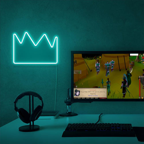 The Runescape Partyhat LED neon sign proudly sits next to a gaming PC, symbolizing the rare and coveted Partyhat in Old School RuneScape. An emblem of wealth and celebration, this LED neon sign adds a touch of extravagance and rarity to any gaming space. 