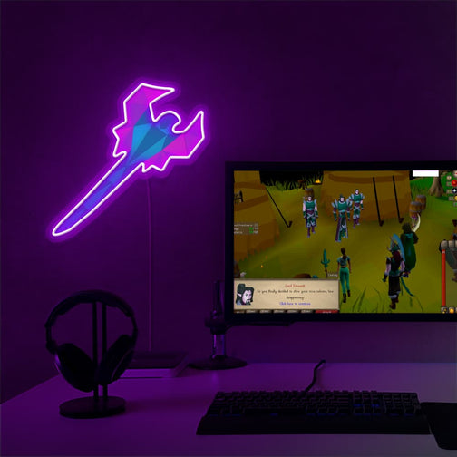 The Runescape Toxic Blowpipe LED neon sign proudly sits next to a gaming PC, symbolizing the deadly venom and precision of the Toxic Blowpipe in RuneScape. An emblem of ranged combat prowess and lethality, this LED neon sign adds a touch of danger and excitement to any gaming space.